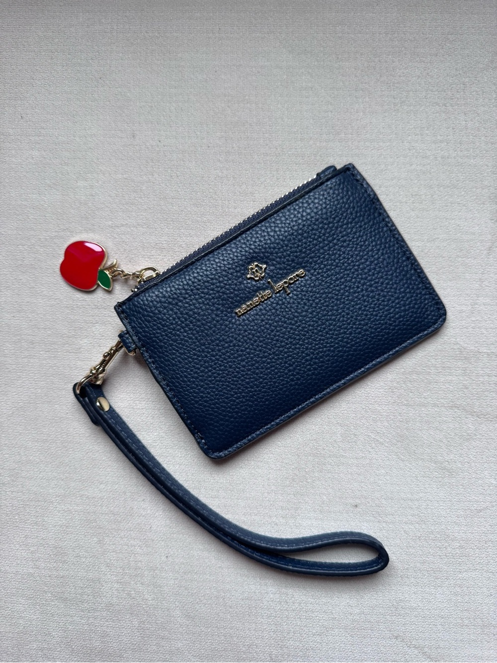 Nanette lepore navy pebbled leather wristlet with apple charm